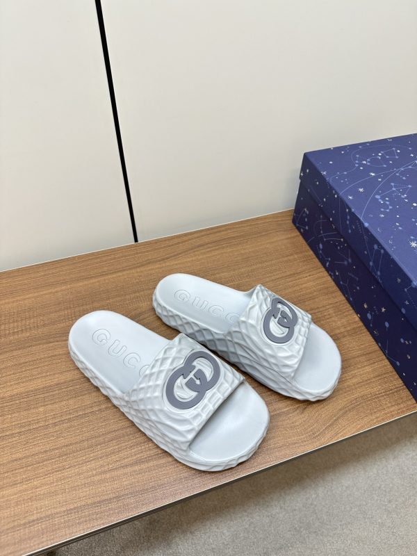 Gucci’s latest couple’s slip-flops silver A